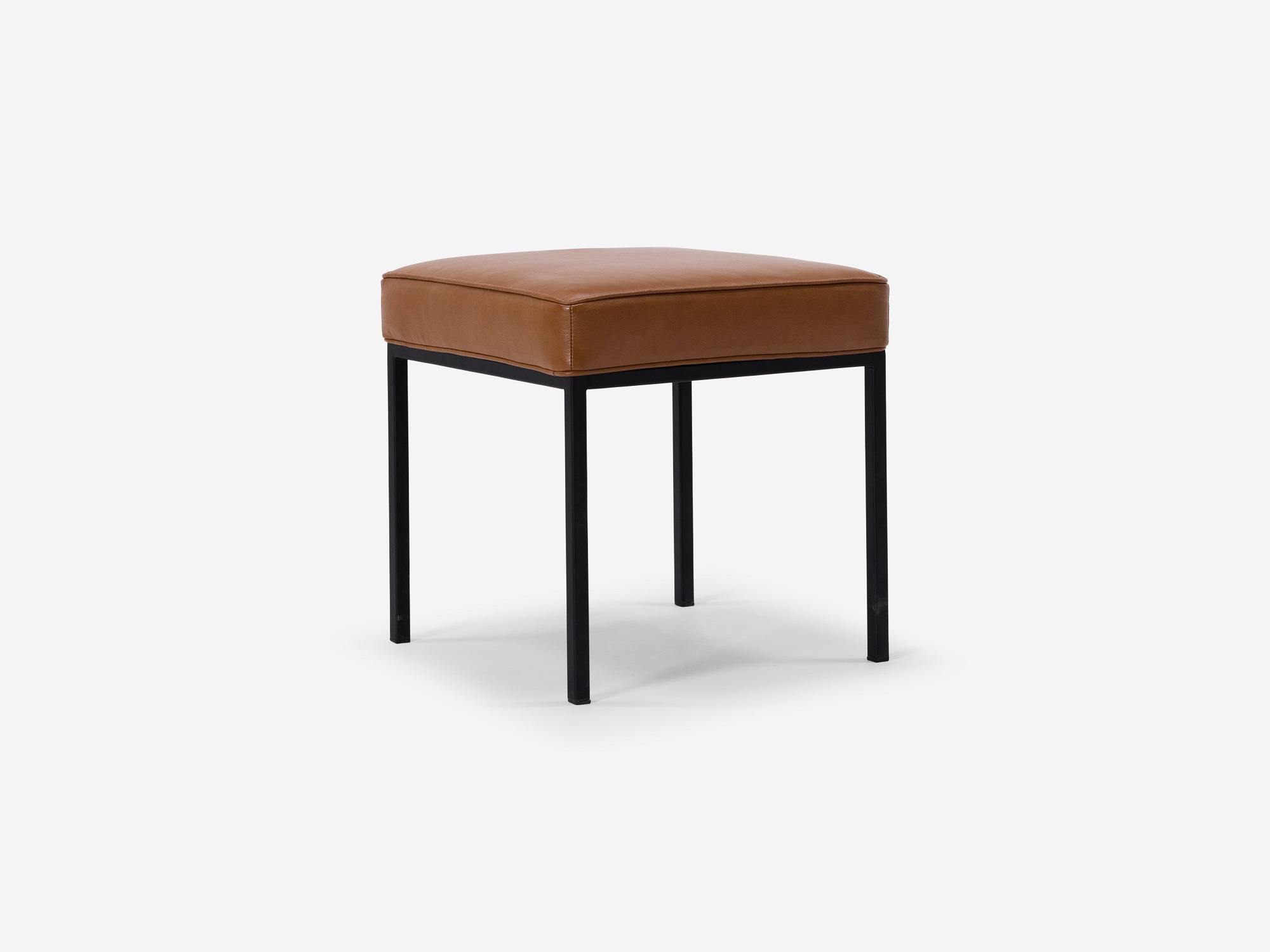 Angled view of the Bank fabric stool with dark brown leather seat and black base